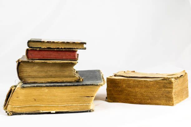 istock Old dusty book on white isolated background 673007104