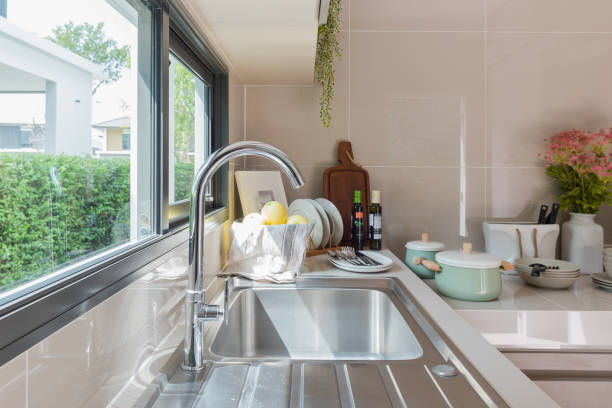 istock stainless steel sink with faucet on kitchen counter 673008234
