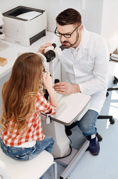 istock Trained experienced doctor adjusting the equipment 673011278