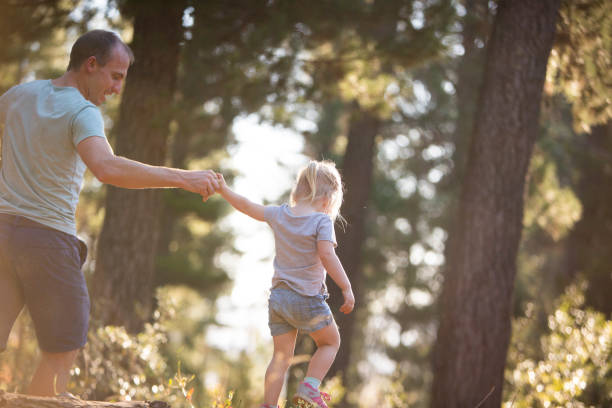 istock Father playing outdoors with his baby daughter 673011346