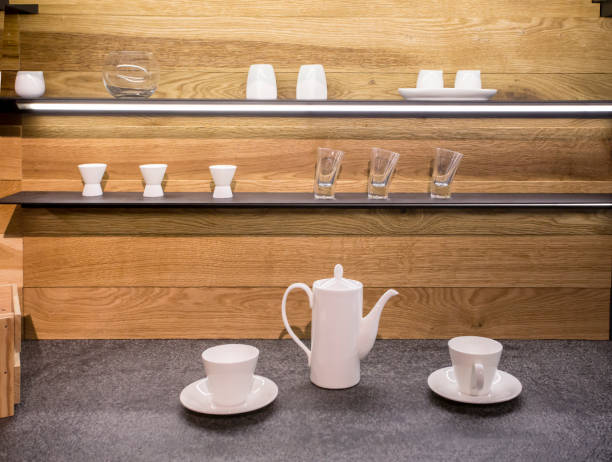 istock two white cups and teapot on the table in the kitchen 673011678