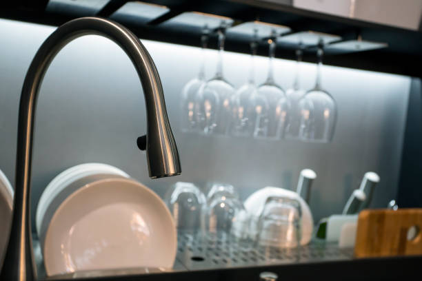 istock Modern luxury kitchen with dishes and chrome water tap 673011762