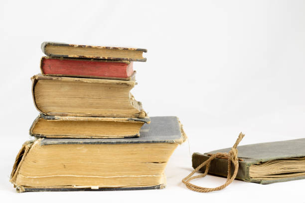 istock Old dusty book on white isolated background 673011784