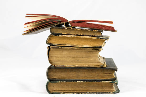 istock Old dusty book on white isolated background 673017550