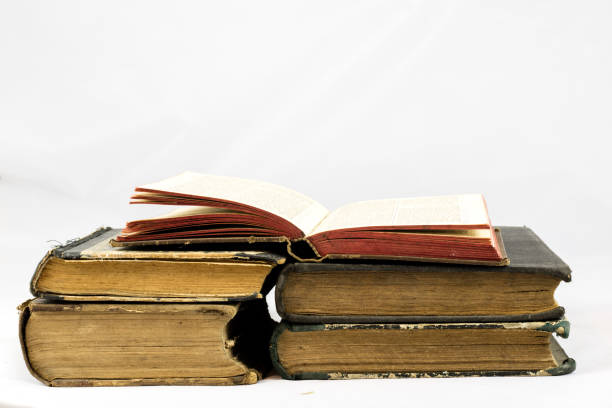 istock Old dusty book on white isolated background 673017554