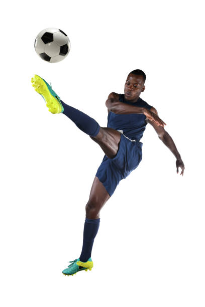 istock Soccer Player Kicking Ball 673020946