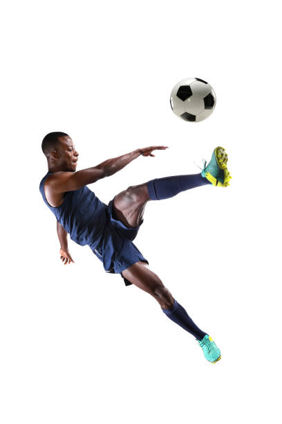 istock Soccer Player Kicking Ball 673021146