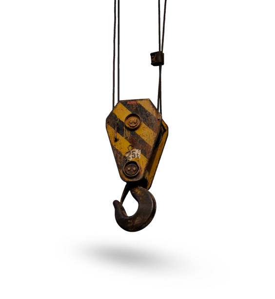 istock Old yellow lifting crane hook isolated on white background. 673022216