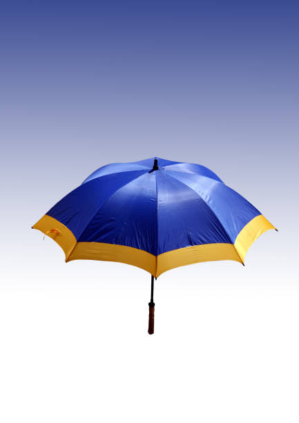 istock Blue - yellow beach umbrella on a white - blue background 673027742