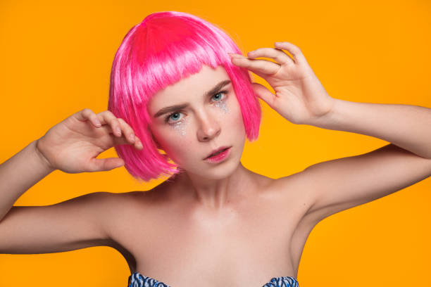 istock Young woman in wig posing 673033156