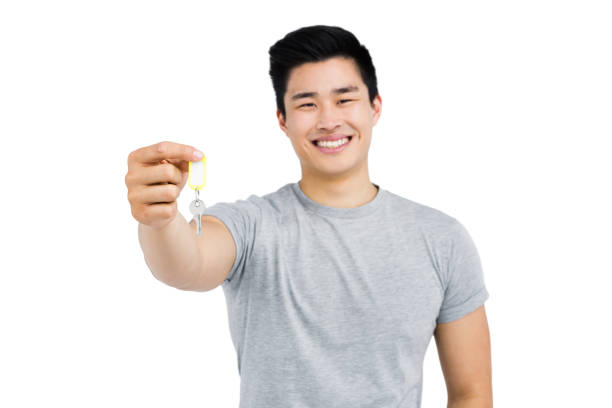 istock Happy man showing house key 673034478