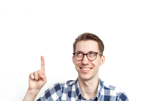istock Young smart male pointing up 673039688