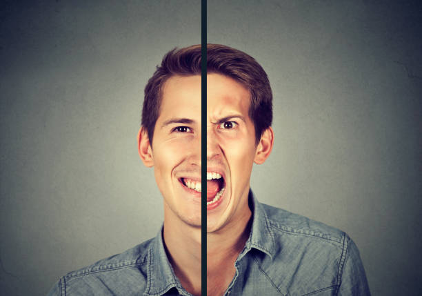 istock Bipolar disorder concept. Young man with double face expression isolated on gray background 673040214