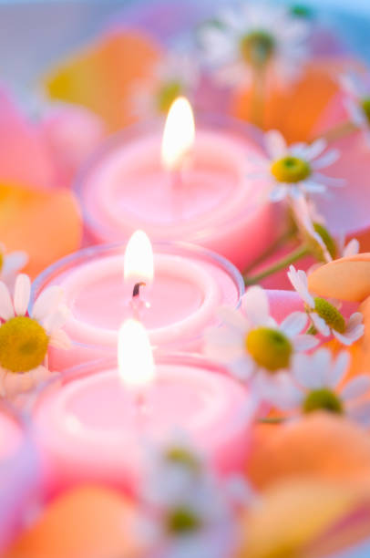 istock Scented candles and flowers 673040410