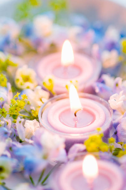 istock Scented candles and blue flowers 673040684