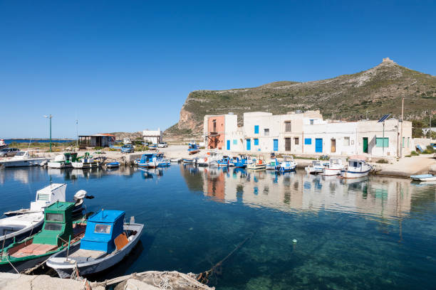 Punto Longa village, Favignana, Sicily The fishing village of Punto Longa on the mediterranean island of Favignana which belongs to the Aegadian island archipelago of Sicily, Italy favignana photos stock pictures, royalty-free photos & images