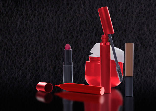 istock Cosmetic products in red tones with reflection 673051654