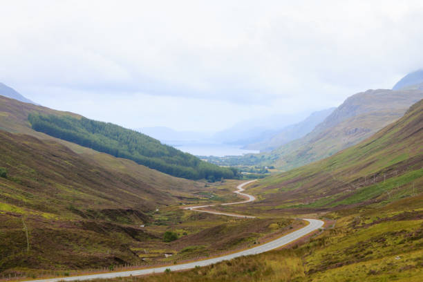 istock Scottish road trough countryside 673055546