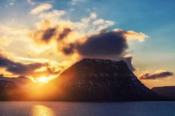 Photo of Sunset behind the famous mountain Kirkjufell in Iceland