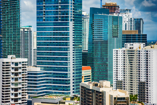 The densely packed high rise buildings in downtown Miami Florida as shot from a helicopter over Biscayne Bay during a photo flight.