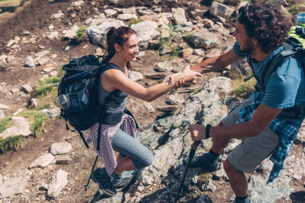 istock Young couple hiking 673062540