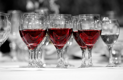 Wine glasses with red wine in lines