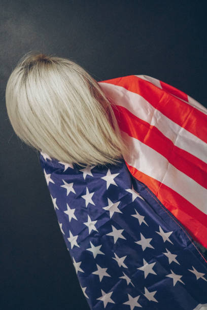 istock Blonde girl with USA flag 673070352