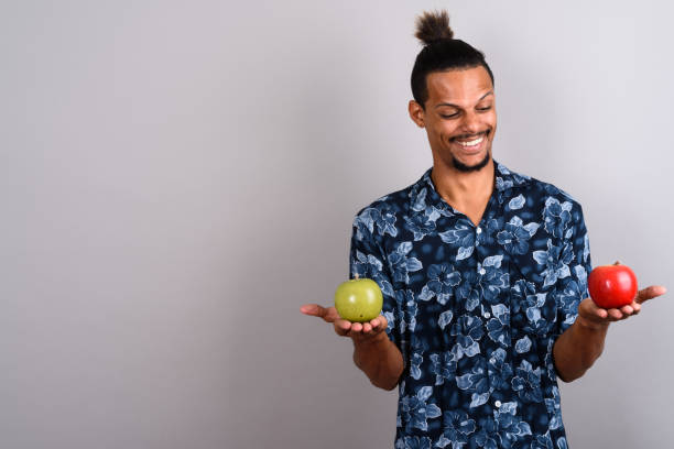 istock Studio shot of young handsome African man against gray background 673073994