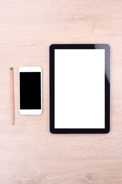 istock Blank screen smartphone and tablet on wooden background 673074280