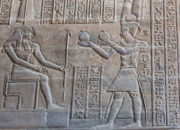 istock Hieroglyphic carvings on an ancient egyptian temple wall 673077874