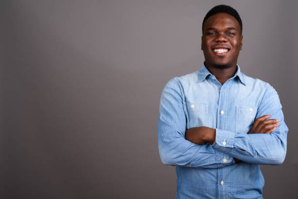 istock Studio shot of young African man against gray background 673079018