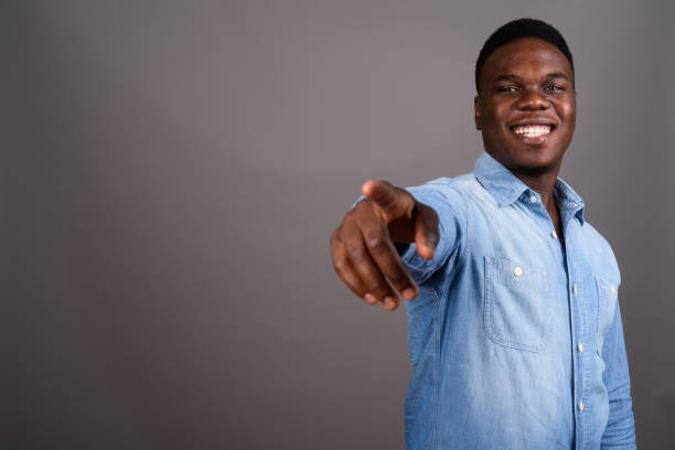 istock Studio shot of young African man against gray background 673079192