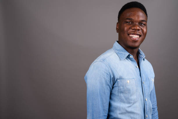 istock Studio shot of young African man against gray background 673080358