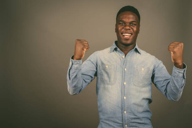 istock Studio shot of young African man against gray background 673083766