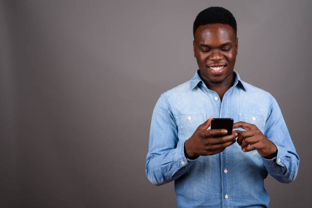 istock Studio shot of young African man against gray background 673084672