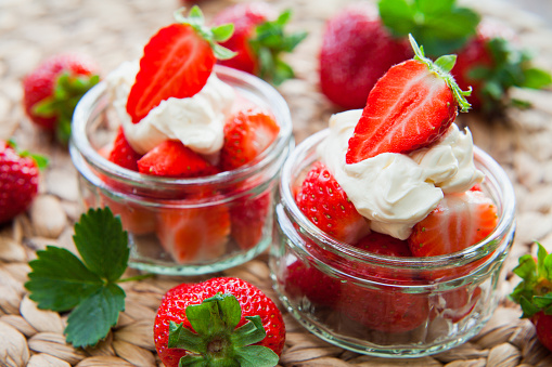 Greek Style thick Yogurt and Fresh ripe Strawberry  Fruit . Healthy diet summer dessert.