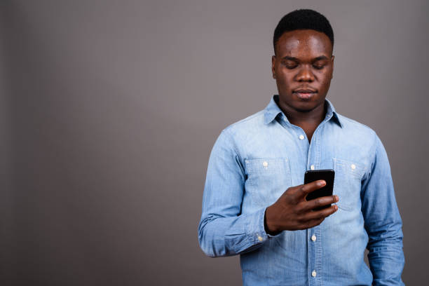 istock Studio shot of young African man against gray background 673084768