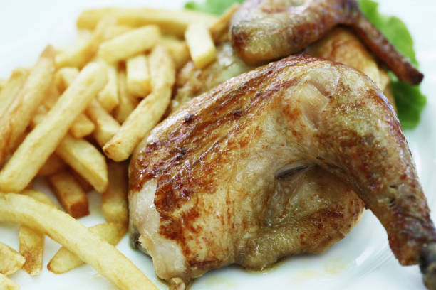 istock Chicken grill with a potato drumsticks 673085042
