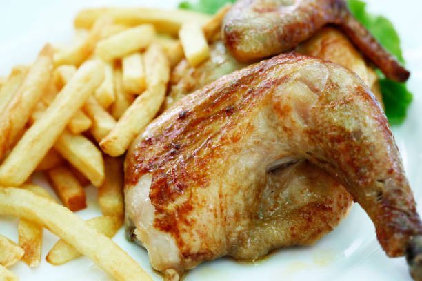 istock Chicken grill with a potato drumsticks 673085076
