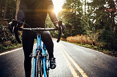 Cyclist Riding Mountain Road on Racing Bike