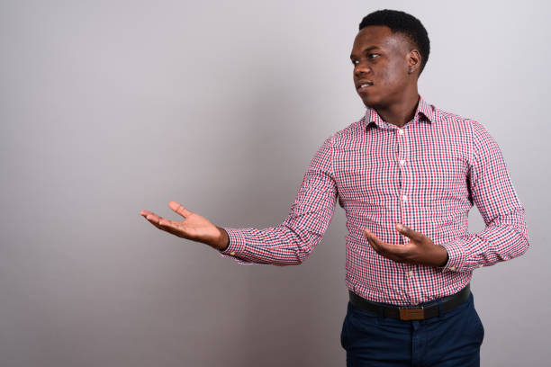 istock Studio shot of young African man against gray background 673085480