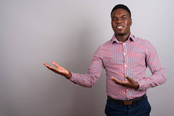istock Studio shot of young African man against gray background 673085486