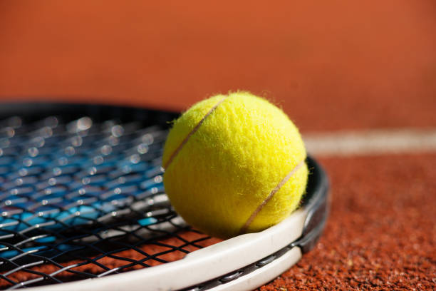 istock Tennis racket and ball on court 673086170
