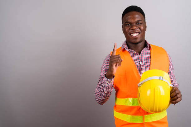 istock Studio shot of young African man construction worker against gray background 673087526