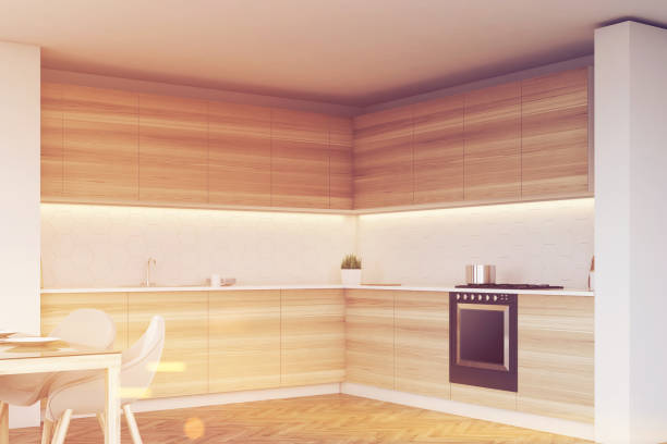 istock Corner of wooden kitchen with countertops, toned 673089954