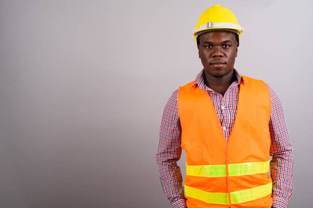 Close up of happy african construction worker, plumber, electrician, handyman