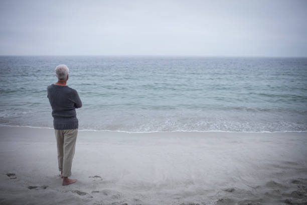 Woman walking along an empty beach