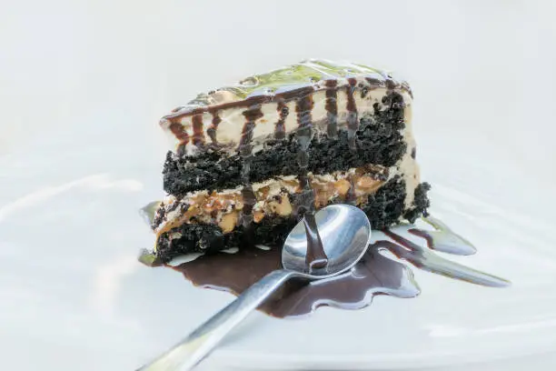 Chocolate cake pie with cream and peanuts and different layers
