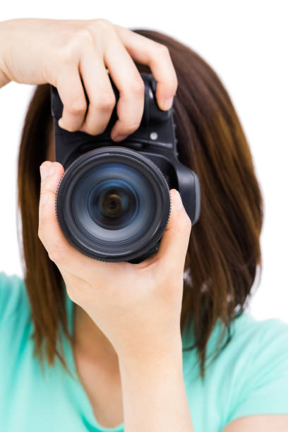 istock Woman photographing with camera 673091530