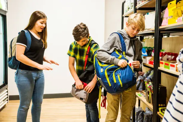 Four children shoplifting in a supermarket.